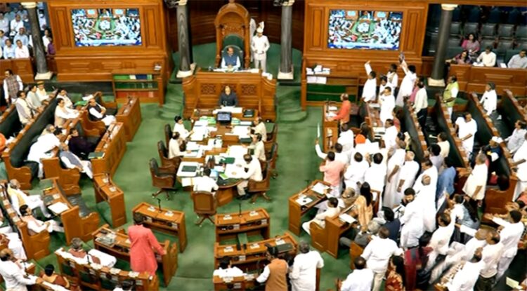 New Delhi: Opposition MPs shout slogans in Lok Sabha during the budget session of Parliament in New Delhi on Tuesday, March 14, 2023. (Photo: Lok Sabha/IANS)