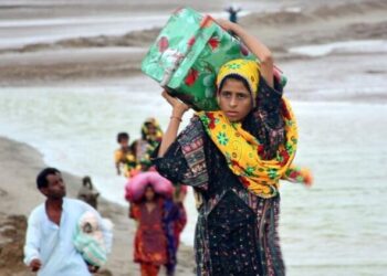 People are pictured as they evacuate from Thatta district of southern Pakistan's Sindh province on June 13, 2023.(Str/Xinhua/IANS)