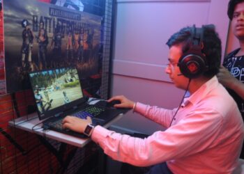 New Delhi: Visitors check out the features of an HP laptop at the launch of HP Pavilion Gaming and Omen laptops, in New Delhi on July 10, 2018. (Photo: IANS)