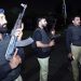 Police officers are seen near the site of an attack in Karachi, Pakistan, on Feb. 17, 2023. At least three attackers were killed and 10 people wounded on Friday night when a group of terrorists opened fire at a police building in Karachi, police and hospital officials said. (Str/Xinhua)