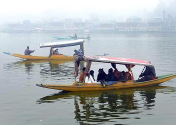 Srinagar : Tourists take a Shikara ride at Dal Lake in Srinagar on Monday, November 27, 2023. (Photo: IANS/Nisar Malik)