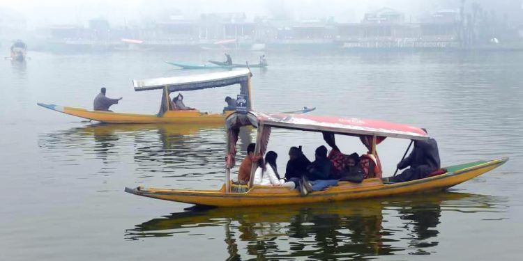 Srinagar : Tourists take a Shikara ride at Dal Lake in Srinagar on Monday, November 27, 2023. (Photo: IANS/Nisar Malik)