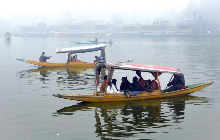 Srinagar : Tourists take a Shikara ride at Dal Lake in Srinagar on Monday, November 27, 2023. (Photo: IANS/Nisar Malik)