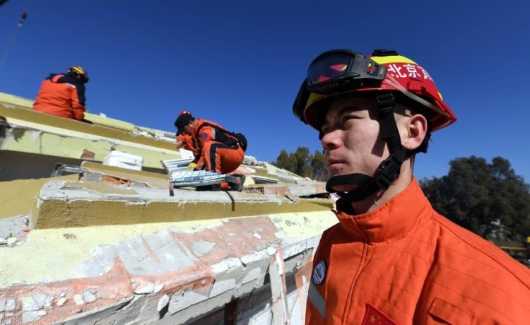 Members of the China Search and Rescue Team carry out a rescue operation inside earthquake debris in Antakya in the southern province of Hatay, Turkey, Feb. 9, 2023. An 82-member Chinese rescue team that arrived in TÃ¼rkiye on Wednesday rushed to the quake-impacted zone to assist in rescue efforts. (Xinhua/Shadati)