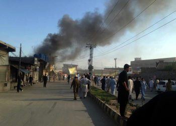 Parachinar: Photo taken with mobile phone shows smoke rises from a blast site in northwest Pakistan's Parachinar, on June 23, 2017. At least 18 people were killed and over 100 others injured as twin blasts ripped through a market on Friday afternoon in Parachinar, capital city of Pakistan's northwest tribal area of Kurram Agency, reported local Urdu TV channel Geo. (Xinhua/Stringer/IANS)