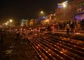 Varanasi:Devotees light earthen lamps on the bank of River Ganga during Dev Deepawali Festival in Varanasi on Friday November 19,2021.(PHOTO:IANS)