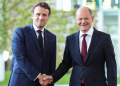 German Chancellor Olaf Scholz (R) shakes hands with visiting French President Emmanuel Macron at the German Chancellery in Berlin, capital of Germany, May 9, 2022. (Xinhua/Shan Yuqi/IANS)