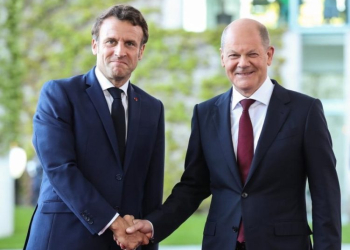 German Chancellor Olaf Scholz (R) shakes hands with visiting French President Emmanuel Macron at the German Chancellery in Berlin, capital of Germany, May 9, 2022. (Xinhua/Shan Yuqi/IANS)