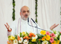 Chitrakoot: Union Home Minister Amit Shah addresses the tribute meeting of Bharat Ratna Nanaji Deshmukh on his 15th death anniversary in Chitrakoot on Thursday, February 27, 2025. (Photo: IANS)