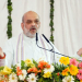 Chitrakoot: Union Home Minister Amit Shah addresses the tribute meeting of Bharat Ratna Nanaji Deshmukh on his 15th death anniversary in Chitrakoot on Thursday, February 27, 2025. (Photo: IANS)