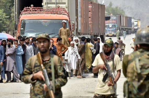 Afghan people are seen on Afghan side of the border near the border crossing point of Torkham between Pakistan and Afghanistan on Sept. 5, 2021. (Photo by Saeed Ahmad/Xinhua/IANS)