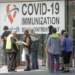 People line up outside a COVID-19 vaccination clinic in New Westminster, British Columbia, Canada, on June 18, 2021. (Photo by Liang Sen/Xinhua/IANS)