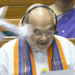 New Delhi: Paper bits allegedly thrown at Union Home Minister Amit Shah while he speaks in the Lok Sabha during the monsoon session of Parliament, in New Delhi on Wednesday, Aug 20, 2025. (Photo: IANS/Sansad TV)