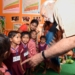 Jangla: Prime Minister Narendra Modi interacts with beneficiary children of Poshan Abhiyan in Chhattisgarh's Jangla, on April 14, 2018. Also seen Chhattisgarh Chief Minister Raman Singh. (Photo: IANS/PIB)