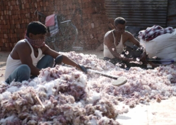 Agartala: Workers beat cotton to make blankets during winter season, in Agartala on Wednesday, December 29, 2021. (Photo: IANS/Abhishek Saha)