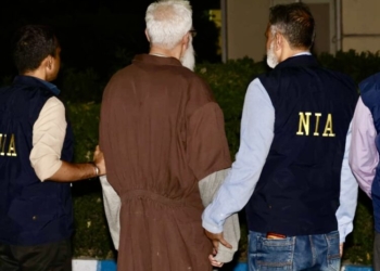 New Delhi: NIA personnel escort Tahawwur Rana after his arrival in India following extradition from the US.