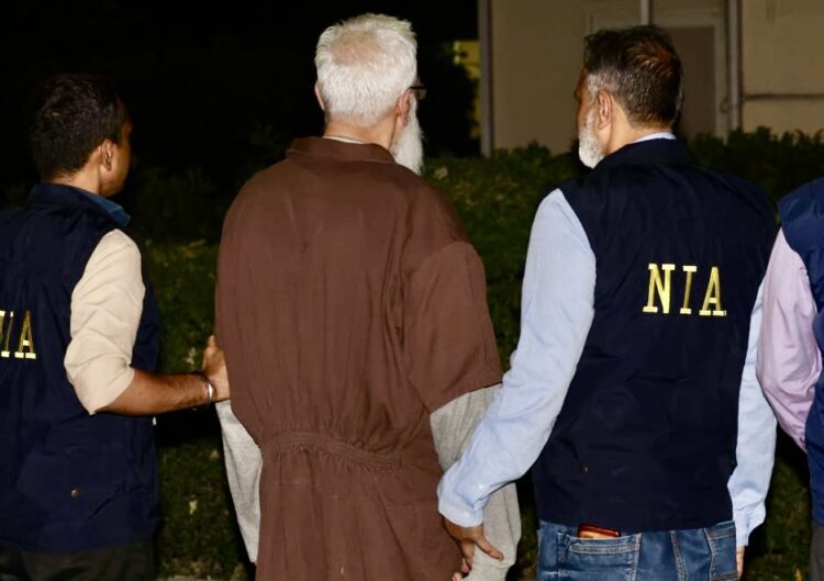 New Delhi: NIA personnel escort Tahawwur Rana after his arrival in India following extradition from the US.