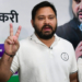 Patna: Rashtriya Janata Dal (RJD) leader and Leader of Opposition in the Bihar Assembly Tejashwi Yadav flashes a victory sign during a press conference in Patna on Wednesday, November 12, 2025. (Photo: IANS)