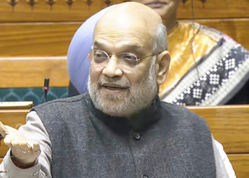 New Delhi: Union Home Minister Amit Shah speaks in the Lok Sabha during the winter session of Parliament in New Delhi on Wednesday, December 10, 2025. (Photo: IANS/Video Grab/Sansad TV)