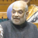 New Delhi: Union Home Minister Amit Shah speaks in the Lok Sabha during the winter session of Parliament in New Delhi on Wednesday, December 10, 2025. (Photo: IANS/Video Grab/Sansad TV)