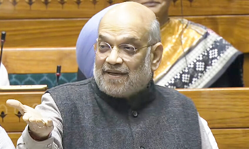 New Delhi: Union Home Minister Amit Shah speaks in the Lok Sabha during the winter session of Parliament in New Delhi on Wednesday, December 10, 2025. (Photo: IANS/Video Grab/Sansad TV)