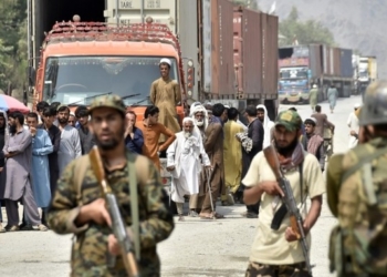 Afghan people are seen on Afghan side of the border near the border crossing point of Torkham between Pakistan and Afghanistan on Sept. 5, 2021. (Photo by Saeed Ahmad/Xinhua/IANS)