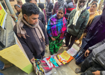 Birbhum: People place their SIR papers wrapped in plastic bags to secure their turn in queues outside the Suri Block 1 office as they arrive to attend the ongoing Special Intensive Revision (SIR) hearing in the Birbhum district of West Bengal, on Friday, January 02, 2026. (IANS)