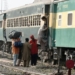 Passengers get on a train at a railway station ahead of the Islamic Eid al-Fitr festival in Lahore, Pakistan, April 30, 2022. (Photo by Sajjad/Xinhua/IANS)