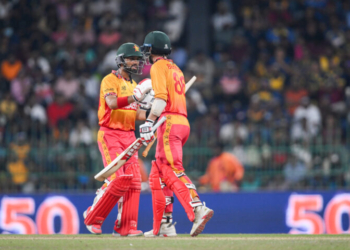 Colombo: Zimbabwe's Brian Bennett celebrates with captain Sikandar Raza after scoring fifty runs during the Group B ICC Men's T20 World Cup 2026 match between Sri Lanka and Zimbabwe at R. Premadasa Stadium in Colombo on Thursday, February 19, 2026. (Photo: IANS/Biplab Banerjee)