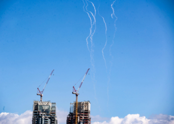 Tel Aviv: This photo taken on March 1, 2026 shows smoke trails left by interceptor missiles launched from Israeli air defense systems in downtown Tel Aviv, Israel. Multiple explosions were heard in Tel Aviv on Sunday, eyewitnesses said, as Israel's military said it was operating to intercept new barrages of missiles from Iran that triggered air raid sirens across the country. (Xinhua via IANS)