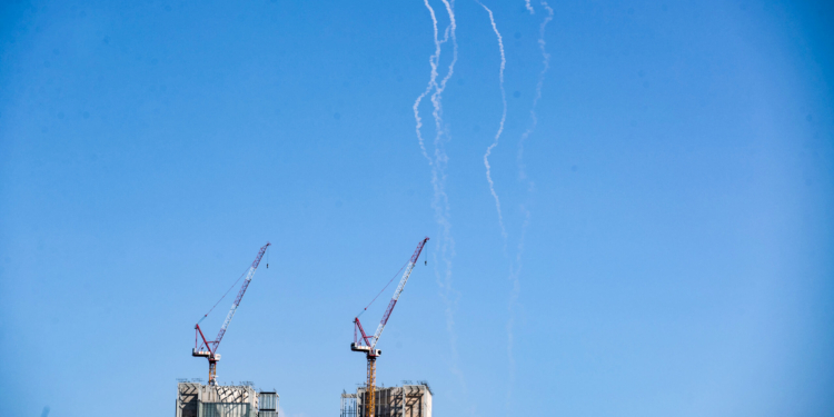 Tel Aviv: This photo taken on March 1, 2026 shows smoke trails left by interceptor missiles launched from Israeli air defense systems in downtown Tel Aviv, Israel. Multiple explosions were heard in Tel Aviv on Sunday, eyewitnesses said, as Israel's military said it was operating to intercept new barrages of missiles from Iran that triggered air raid sirens across the country. (Xinhua via IANS)