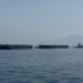 Khasab: This photo taken with a mobile phone shows merchant vessels stranded in the waters of the Strait of Hormuz, near Khasab, a small town in northern Oman, May 29, 2026. (Photo: Xinhua via IANS)