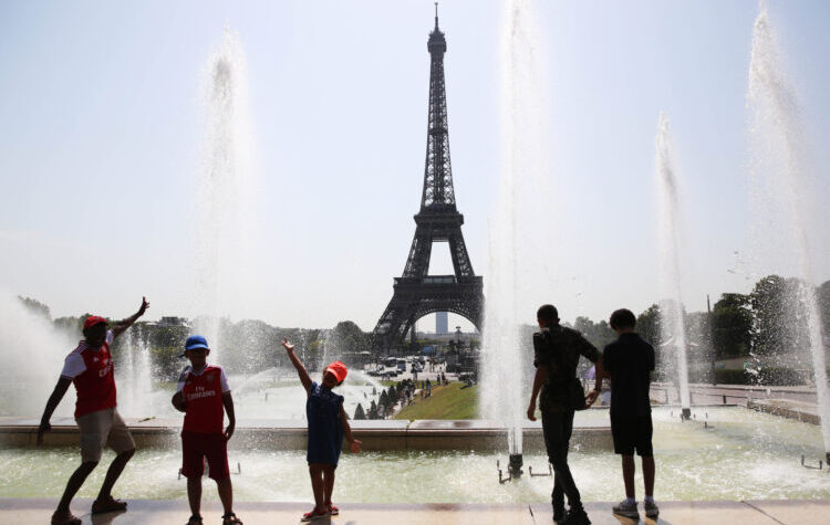 PARIS, July 25, 2019 (Xinhua) -- People pose by a fountain at the Trocadero Place in Paris, France, July 25, 2019. Temperature in Paris hit 42 degrees centigrade on Thursday. (Xinhua/Gao Jing/IANS)