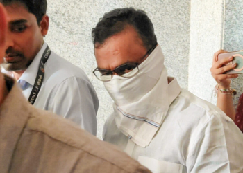 New Delhi: CBI officials escort Director of RCC coaching classes Shivraj Motegaonkar, accused in NEET paper leak case, out of the Rouse Avenue Court after the court extended his CBI custody by one day in New Delhi on Tuesday, May 26, 2026. (Photo: IANS)